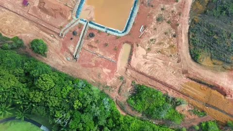 Elevated footage capturing complex interaction between extensive land clear 動画素材 319458887