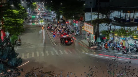 Elevated Hanoi Night Traffic Timelapse: Busy Intersection &amp; Light Trails Stock Footage 334063590