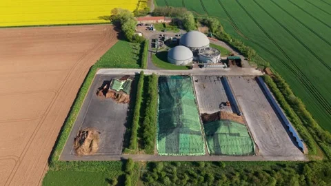 Elevated high angle aerial view of green bioenergy power station set in Stock Footage 345207776