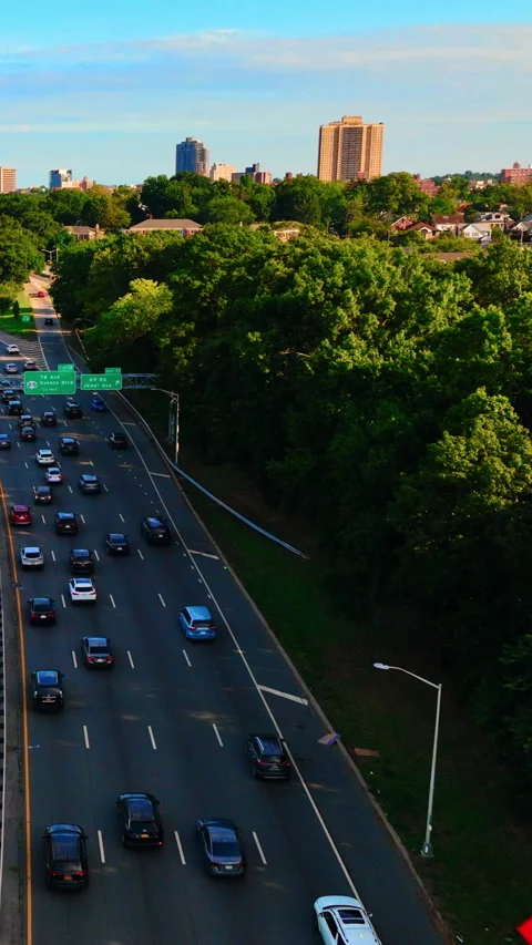Elevated highway lined with trees, Queens, New York Vertical video. Stock Footage 342273707
