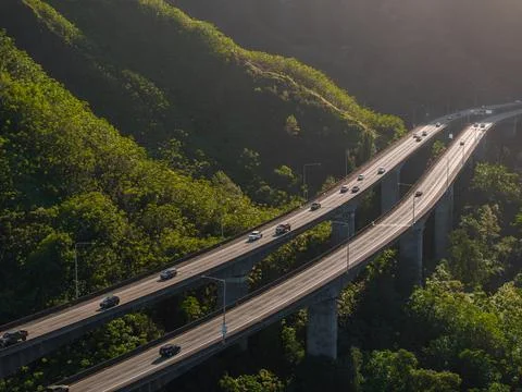 Elevated Highway Through Lush Green Hills in Oahu, Hawaii Stock Photos