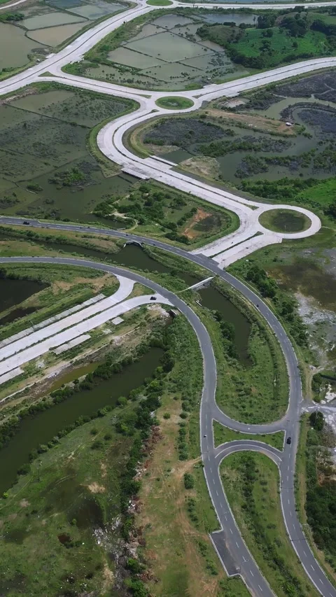 Elevated Interchange Featuring Intertwining Ramps And Lush Embankments Stock-Footage 330501399