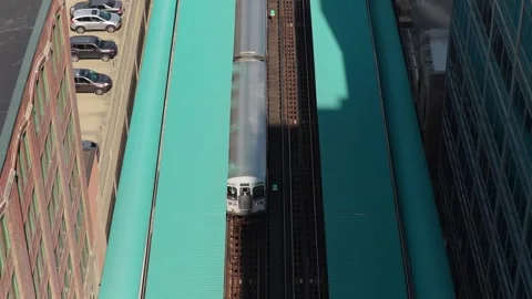 Elevated L train arriving at station on The Loop transit system in Chicago, Illi Stock Footage 338347323