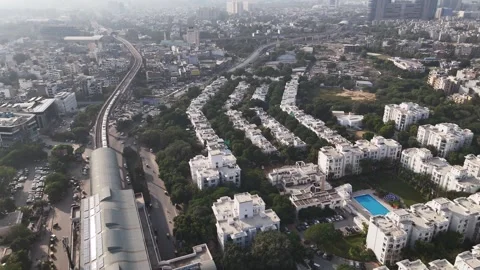 An elevated metro corridor winds across a wide stretch of lush forest in Stock Footage 323429496