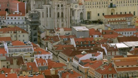Elevated mid shot of the Carmo Convent and elevador Santa Justa Stock Footage 119057177