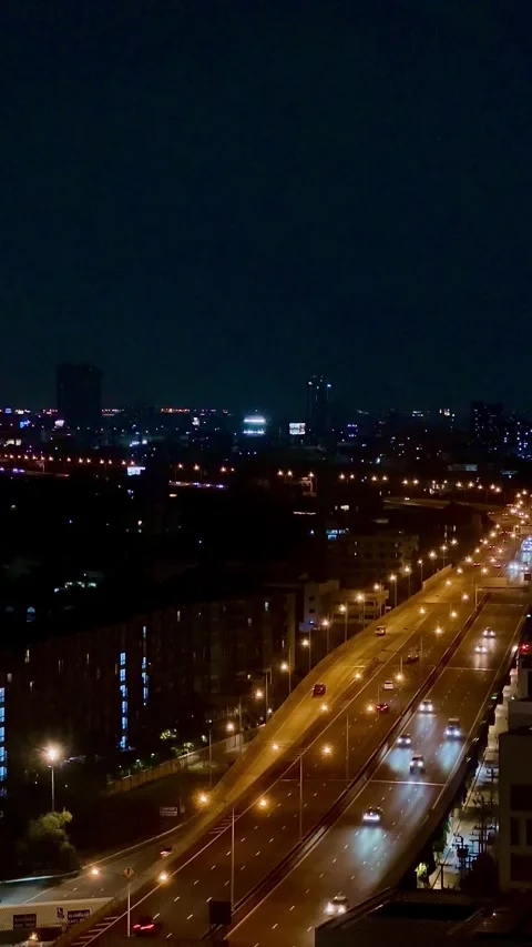 Elevated nighttime view of busy traffic moving Stock Footage 346244932