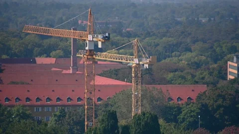 Elevated or aerial view of cranes and building roofs in Munich Stock Footage 164952585