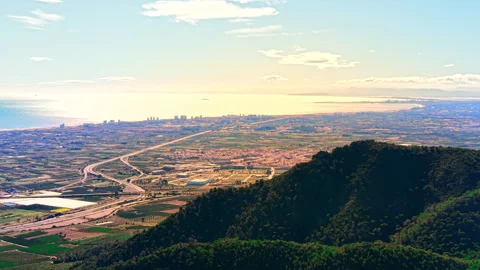 Elevated panorama of coastal plain and city skyline, Valencia, Spain Stock Footage 337464131
