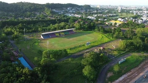 Elevated Panorama of a Colorful Stadium Complex Embraced by Nature and Urba.. Video stock 325277595