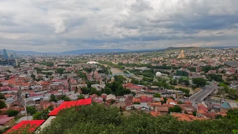 An elevated panorama presents Tbilisi beneath dramatic clouds Stock-Footage 340385068