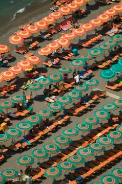 Elevated pattern view of famous beach umbrellas of Amalfi, a town in the Stock Photos