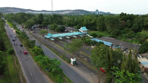 Elevated perspective of active roadway infrastructure amidst lush tropical .. Video stock 339031805
