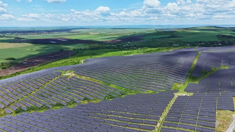 Elevated perspective showing countless shiny solar modules. Spectacular high Stock Footage 337912669
