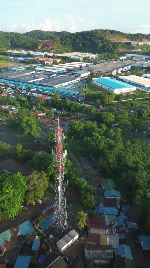 An Elevated Perspective of a Telecommunication Mast Anchoring a Local Commu.. Video stock 337284097