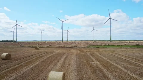 From an elevated perspective, we observe a row of wind turbines gracefully .. Stock Footage 252656967