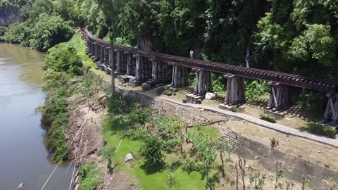 Elevated railway tracks over a quiet river Stock Footage 168575221