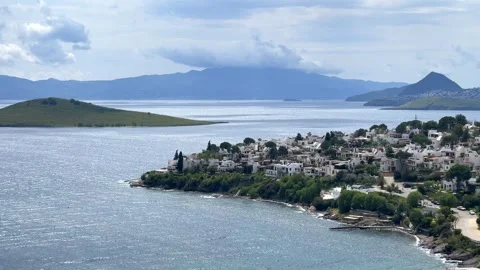 A elevated scenic view of Bitez in Bodrum, Turkey, showing white coastal houses, Stock Footage 346704370