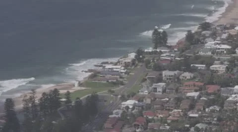 Elevated shot of coastline with surf breaking. Stock Footage 56480298