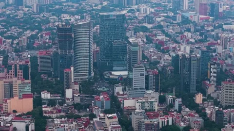 Elevated shot passing between corporate buildings on avenue, Mexico City 動画素材 318199468