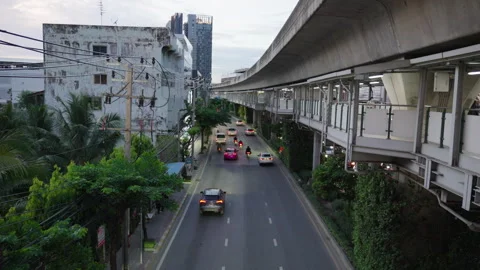 Elevated skytrain view over Bangkok street traffic Stock Footage 345859258