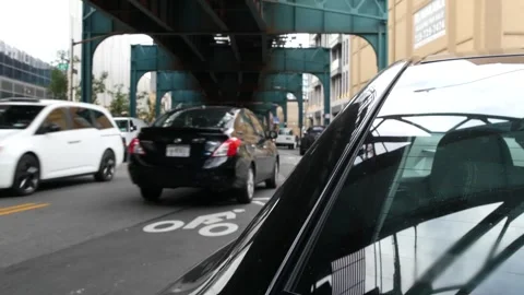 Elevated subway above New York city street. Metropolitan bridge over road Stock Footage 313856430