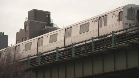 Elevated subway train running in New York City Stock Footage 229869611