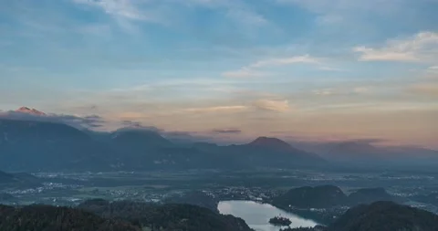 Elevated time lapse of clouds moving over famous landmark lake Bled Stock Footage 219818252