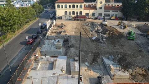 Elevated time lapse day view of workers at busy on-site construction area Stock Footage 92913518