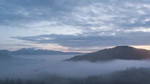 Elevated time lapse of low inversion fog moving in the valley Stock Footage 258107717