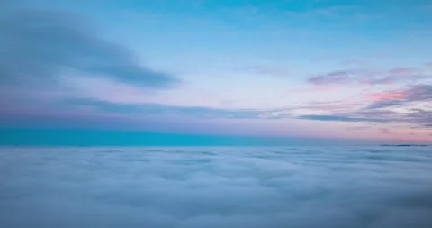 Elevated time lapse of low inverted clouds or fog moving across the lowlands Stock Footage 258818126