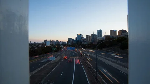 Elevated time lapse shot of highway as the sun sets into night Stock Footage 101796207