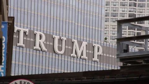 Elevated train in front of Trump Tower sign in Chicago, Illinois Video stock 79698366
