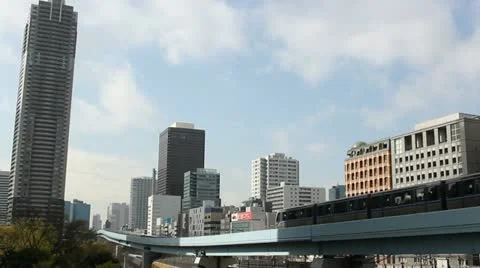 An elevated train passes the Shiodome district in Tokyo, Japan Stock Footage 22417220