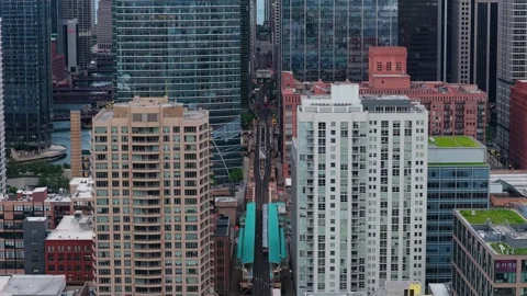 Elevated train traveling on CTA L tracks through Chicago's downtown Loop, passin Stock Footage 337314153