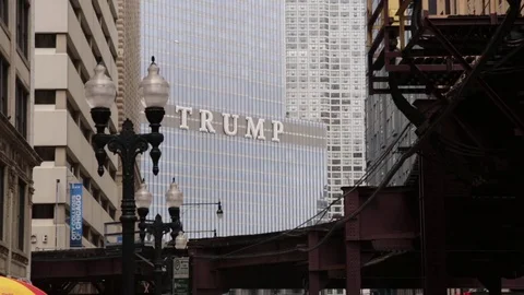 Elevated train under Trump Tower sign in Chicago, Illinois. wide shot Stock Footage 79698554