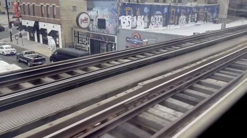 Elevated train view of urban city streets at Chicago and rooftops during a .. Stock Footage 301359876