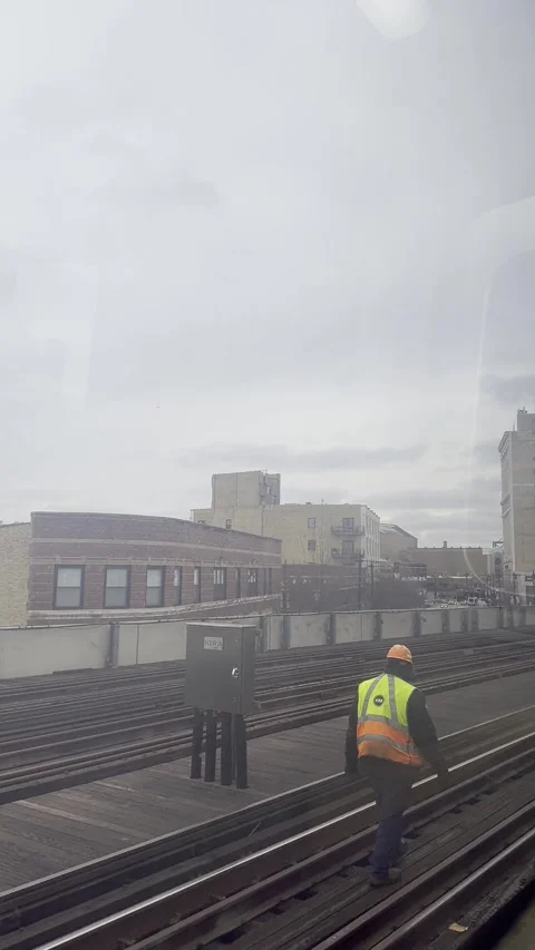Elevated train view of urban city streets at Chicago and rooftops during a .. Stock Footage 301403330