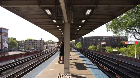 Elevated Trains arrive at the platform. Stock Footage 242921081