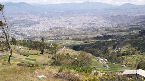 Elevated view of Ambato city surrounded by agricultural landscapes and Andea Vídeo Stock 339346320