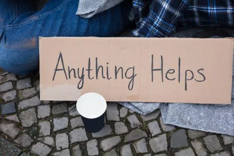 Elevated View Of Anything Helps Text On Cardboard Stock Photos