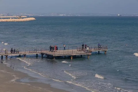 Elevated view of a beach pier and coastal horizon in Larnaca Stock Photos