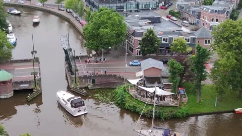 Elevated view of boats passing through the opened bridge in Leeuwarden city Stock Footage 164686078