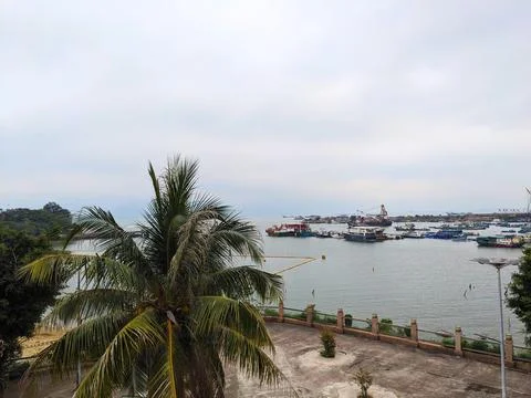 An elevated view of the bustling Castle Peak Bay with boats under a cloudy sky Stock Photos