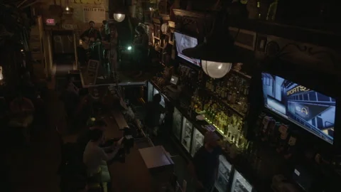Elevated View of Busy Irish Pub with Live Band and Bartender Stock Footage 343951653