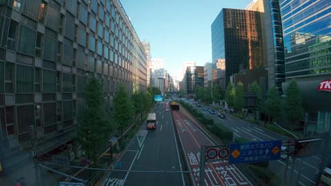 Elevated view of car traffic moving along a modern city street in Tokyo Stock Footage 330262295