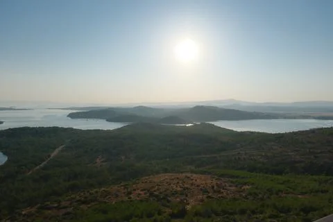 Elevated view of a coastal landscape featuring green islands and blue water Stock Photos