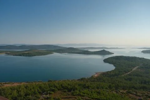 Elevated view of a coastal landscape featuring green islands and blue water Stock Photos