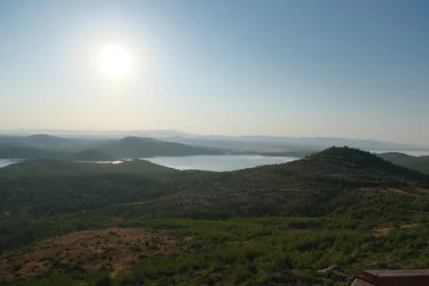 Elevated view of a coastal landscape featuring green islands and blue water Stock Photos