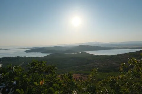 Elevated view of a coastal landscape featuring green islands and blue water Stock Photos