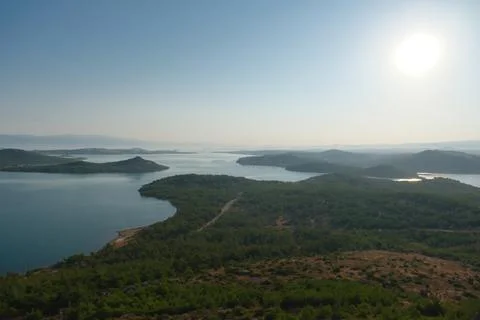 Elevated view of a coastal landscape featuring green islands and blue water Stock Photos